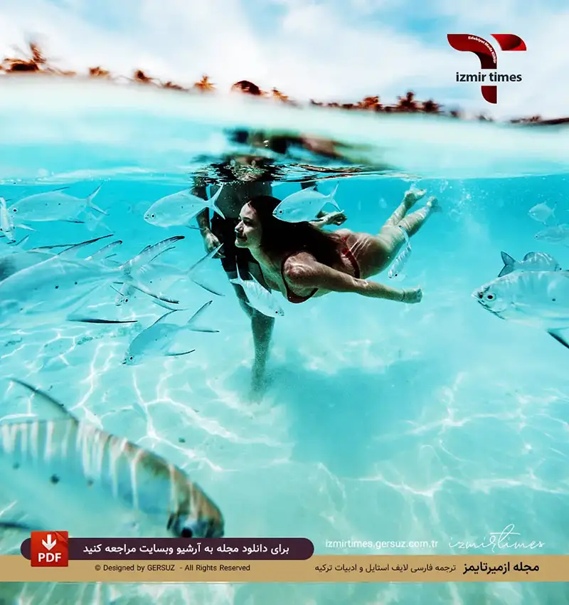 بیکینی قرمز زیر آب کنار ماهیها